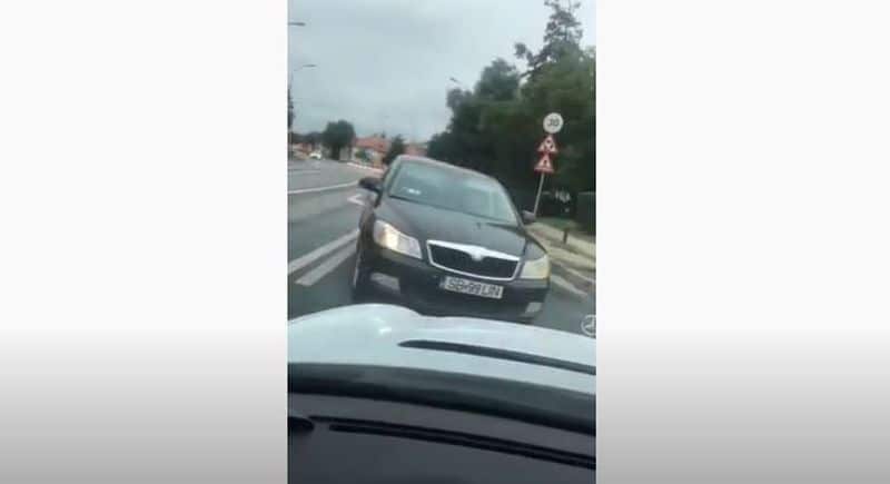 video: bizon cu chip de femeie în trafic - pe contrasens, cu telefonul în mână și recalcitrantă